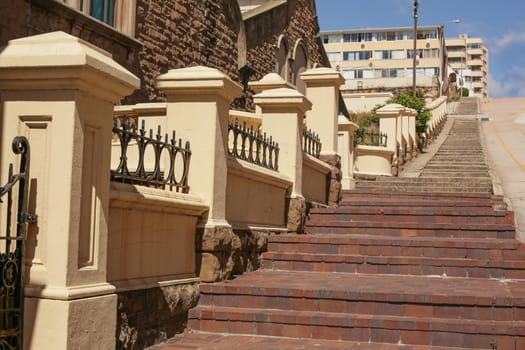 Long and steep pedestrian steps on the side of the road, leading up to the higher grounds of the city of Port Elizabeth