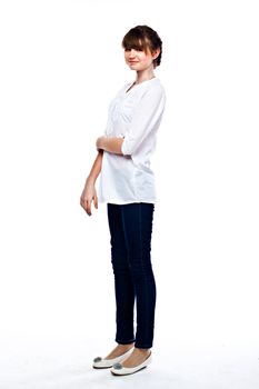 Young and funny girl in a white shirt and dark blue jeans