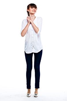 Young and funny girl in a white shirt and dark blue jeans