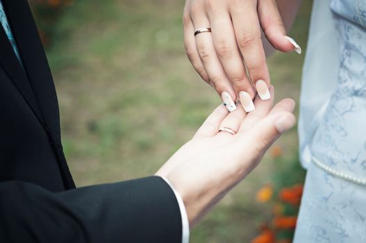 close-up of hands of women and men who were married