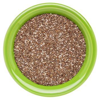 chia seeds  in a green round ceramic bowl isolated on white