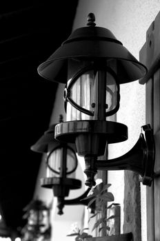 Wrought Iron Street Lamps Old-Fashioned on Building Wall outdoors