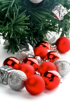 Red and Silver Baubles closeup on New Year Tree background