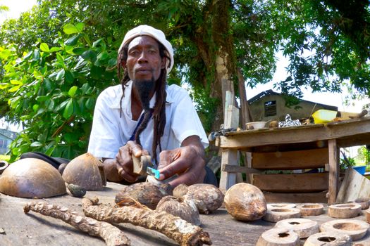 A craftsman works his trade at a market in Belize.