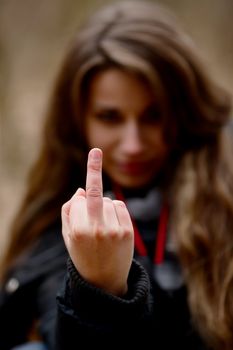 Woman showing middle finger sign