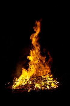 Burning bonfire in the dark