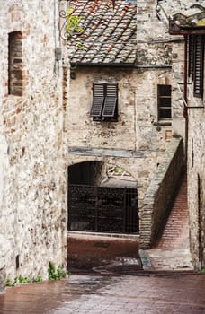 narrow street in a old tuscan village, italy