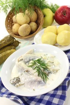 Cream herring with boiled potatoes and cucumber