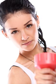 Cute and young girl do exercises with red dumbbells