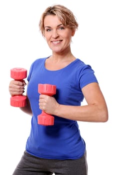Cute mid aged women do exercises with dumbbells isolated on a white