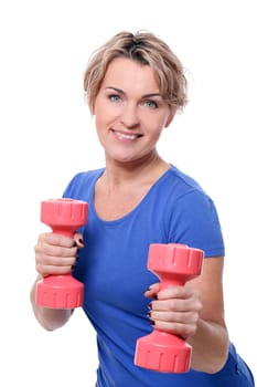 Cute mid aged women do exercises with dumbbells isolated on a white