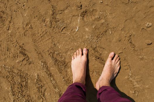 young man barefoot on a beach in Weston-super-Mare, United Kingdom