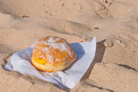 berliner ball on a sandy beach in Algarve, Portugal (traditionally sold during all summer)