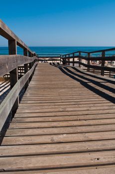 stunning wooden walkway on a sandy beach in Manta Rota (Algarve), Portugal
