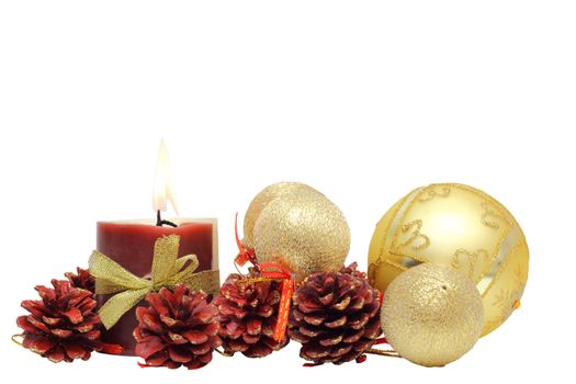 christmas decorations and burning candle isolated on white background