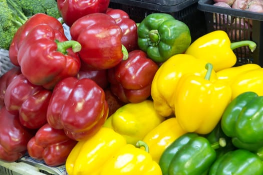 Multiple Colorful Fresh Bell Peppers in Baskets.