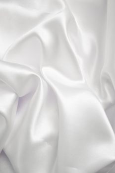 White smooth fabric background with shine.