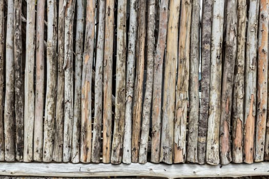 Traditional wooden rural wall from old logs