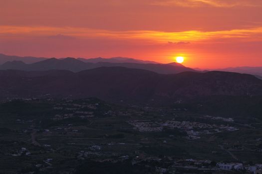 Summer landscape in mountains with the sun