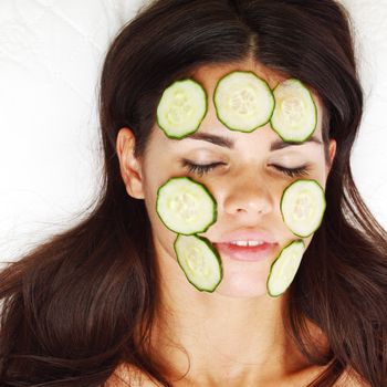 cucumbers circles on a girl face