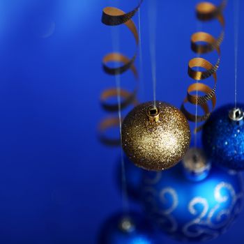 christmas balls on blue satin background