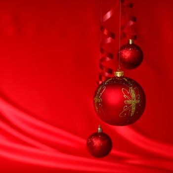  christmas balls on red satin background