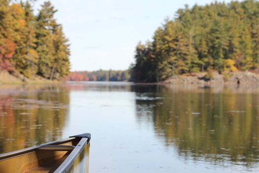 Bow of canoe on calm lake in Killaney Provincial Park, Ontario, Canada
