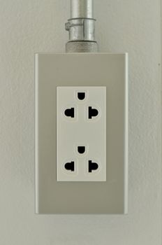 Power outlet on the wall.