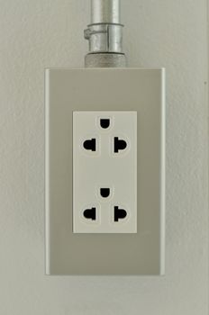 Power outlet on the wall.