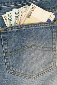 A lot of money in the pocket of a blue jeans