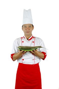 chef holding raw fish on a green plate isolated on white background