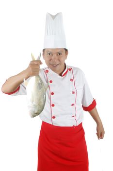 chef holding a big raw fish isolated on white background