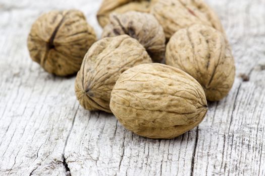 walnuts on old wooden background