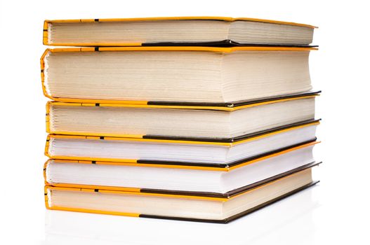 Big stack of yellow books isolated on white background