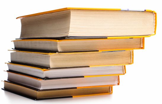 Big stack of yellow books isolated on white background
