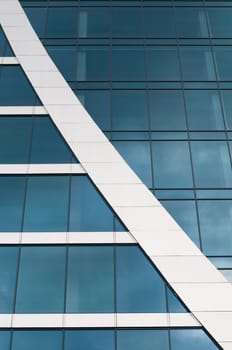 Blue sky reflected in the windows of office building