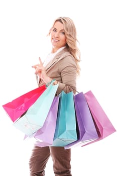 Beautiful middle aged woman holding shopping bags