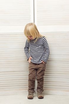 Blonde girl 3 years old dressed as a boy