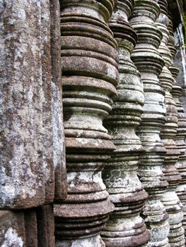 Stone window of temple in Vat Phou, Laos