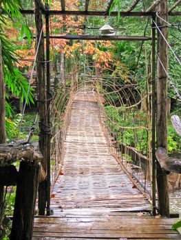 Hanging wooden bridge cross the river