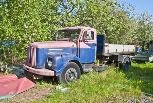 Scania-Vabis was a Swedish truck and car manufacturer. The company was formed from a merger of Scania with the firm of Vabis in 1911. The car production ended in 1929. The Vabis name being dropped from the trucks in 1968.  Image is shot in a grove of trees on an island in Halden called Sheep Island