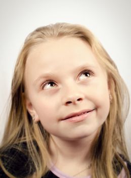 Little girl looking up and smilling