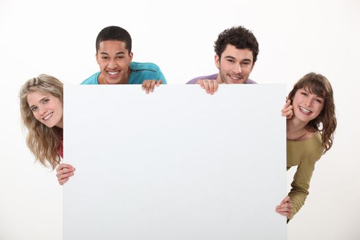 Two couples stood with advertising board