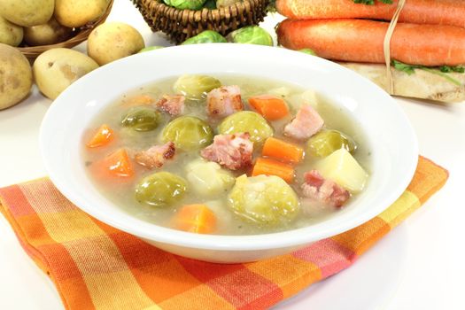 freshly cooked Brussels sprouts soup with potatoes, leeks, carrots, celery and bacon