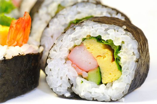 close-up shot of traditional fresh Japanese sushi roll on the white background