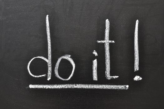 handwritten motivation words - Do it! on the school blackboard