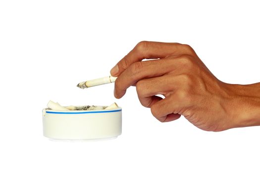 Isolated hand and ceramic ashtray with cigarettes.