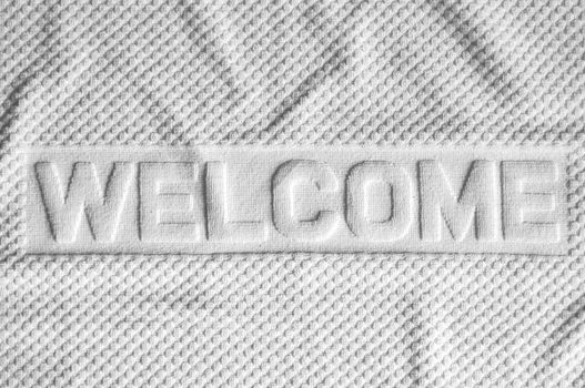 White welcome mat made from fabric