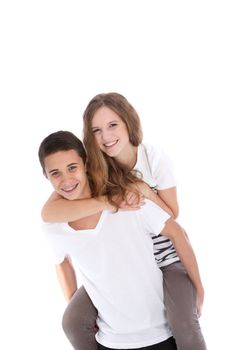 Happy teenage girl getting a piggyback from her brother or boyfriend as they enjoy a fun moment of closeness and affection isolated on white