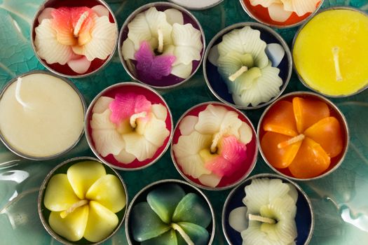 Close-up group of colorful flower shaped candles.